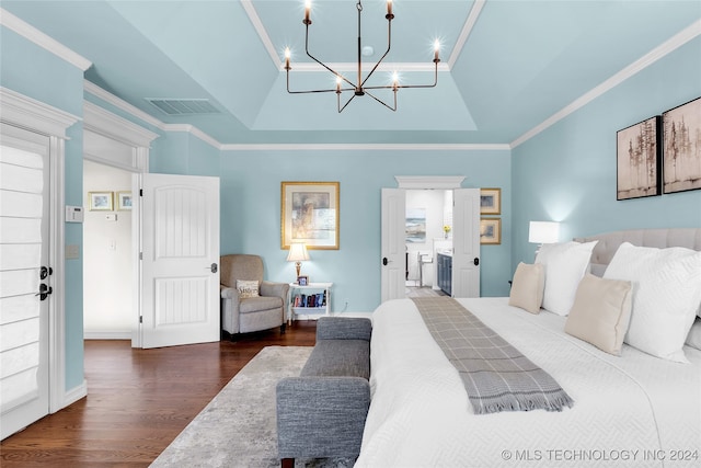 bedroom with a raised ceiling, lofted ceiling, dark wood-type flooring, an inviting chandelier, and crown molding