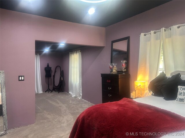 bedroom featuring light colored carpet