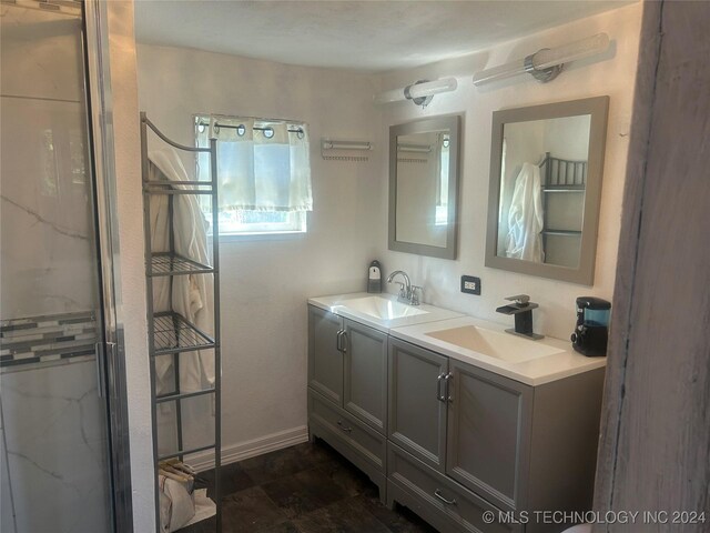 bathroom featuring vanity and an enclosed shower