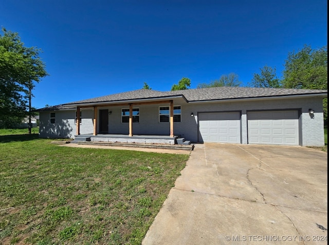 single story home featuring a garage, a porch, and a front lawn