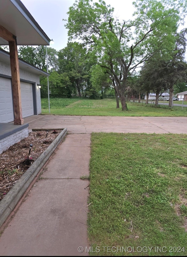 view of yard with a garage