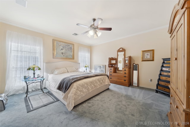 bedroom featuring ceiling fan, carpet flooring, and ornamental molding