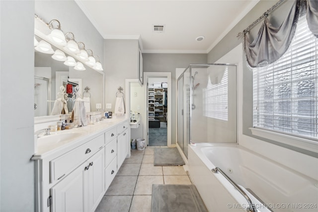 bathroom with ornamental molding, vanity, separate shower and tub, and tile patterned floors