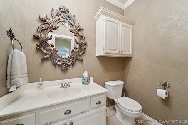 bathroom with tile patterned flooring, crown molding, vanity, and toilet