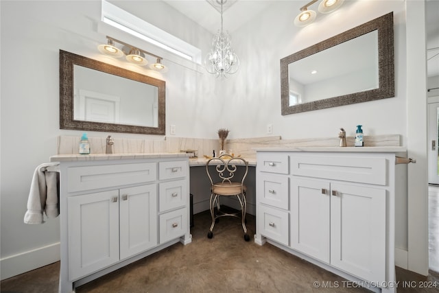 full bath featuring a sink, a chandelier, and two vanities