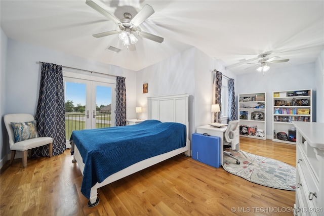 bedroom with light wood-style flooring, a ceiling fan, visible vents, access to exterior, and french doors