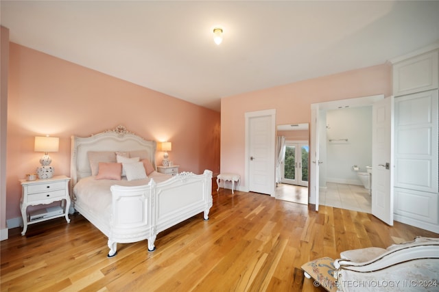 bedroom with baseboards and light wood-style floors