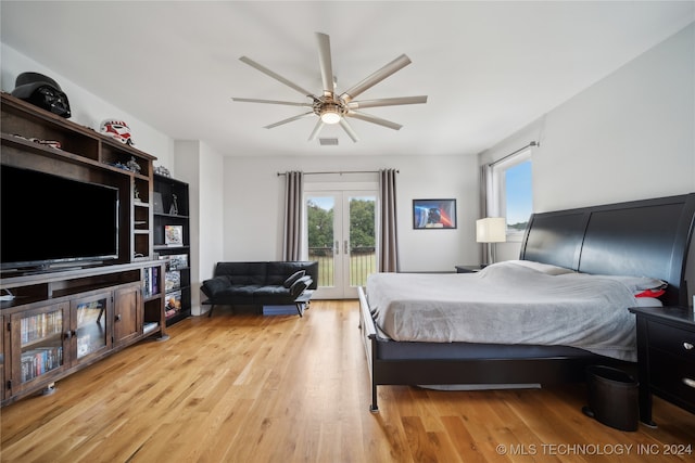 bedroom with visible vents, a ceiling fan, access to outside, french doors, and light wood-type flooring