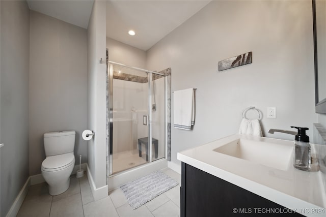 bathroom featuring baseboards, tile patterned flooring, toilet, and a shower stall