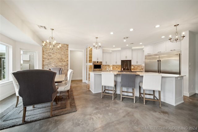 dining room with recessed lighting, visible vents, baseboards, finished concrete flooring, and an inviting chandelier