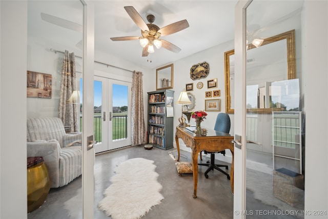 home office with french doors, a ceiling fan, and finished concrete floors