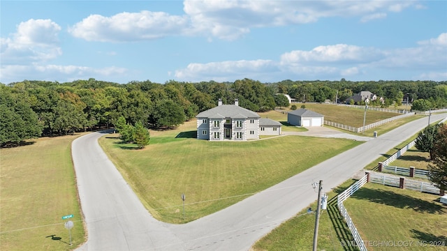 bird's eye view featuring a rural view and a wooded view