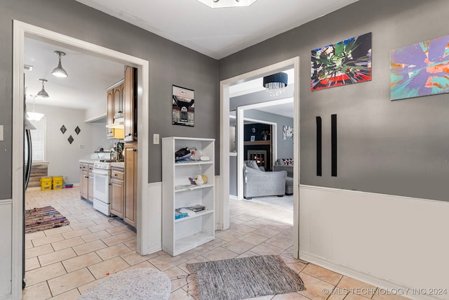 hall with light tile patterned flooring