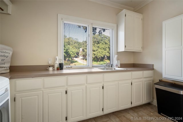 kitchen with sink, white cabinetry, range, and light hardwood / wood-style floors