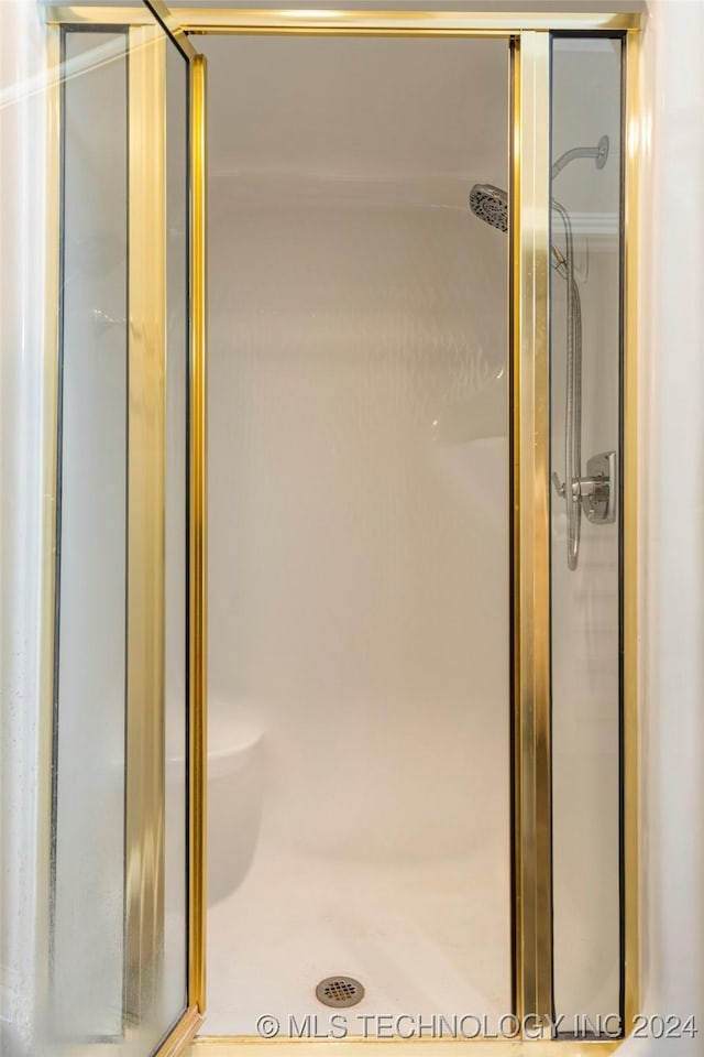 bathroom featuring an enclosed shower