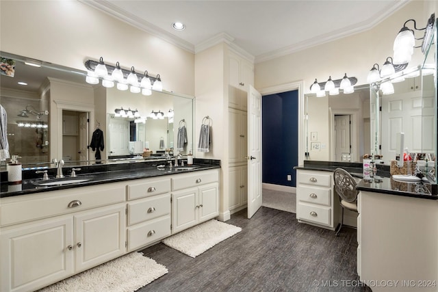 bathroom featuring a shower, crown molding, vanity, and hardwood / wood-style flooring