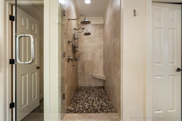 bathroom with crown molding and walk in shower