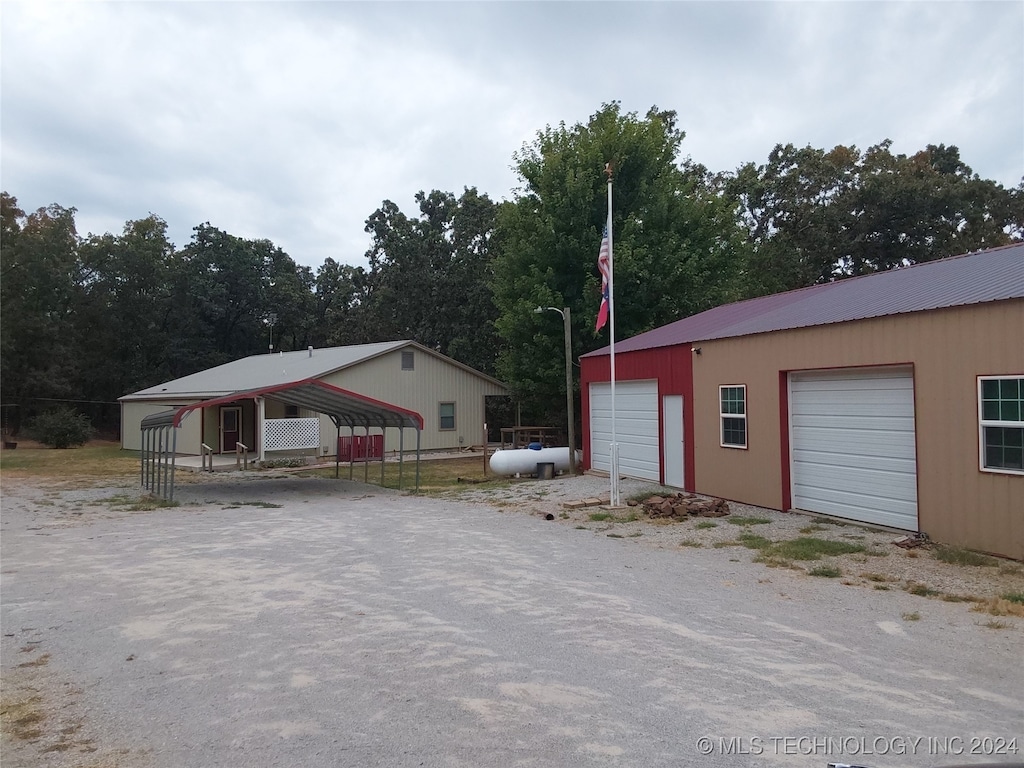 exterior space with a carport