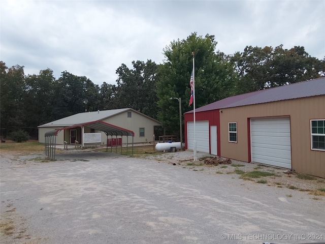 exterior space with a carport