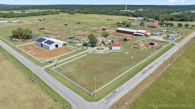 birds eye view of property with a rural view