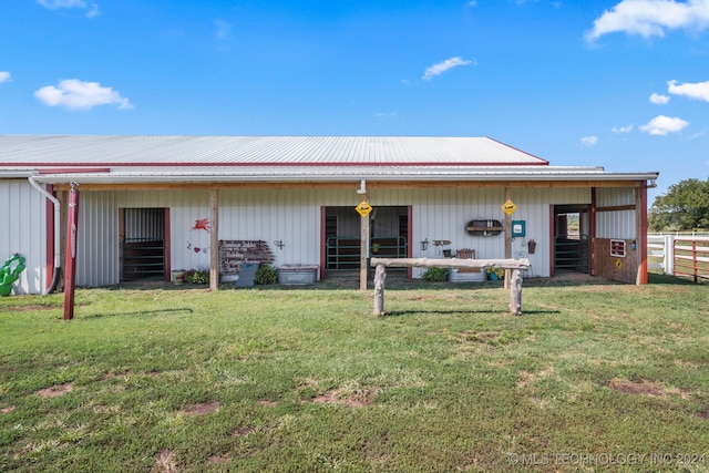 back of property with an outdoor structure