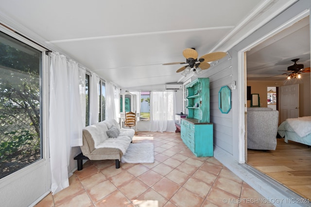 sunroom featuring ceiling fan