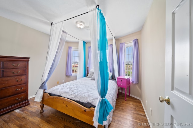 bedroom with hardwood / wood-style flooring