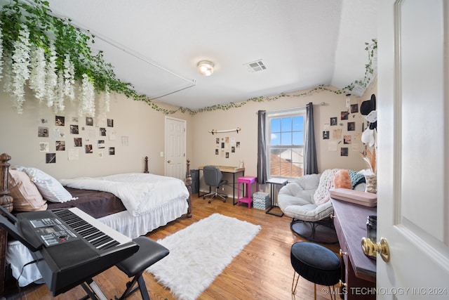 bedroom with hardwood / wood-style floors