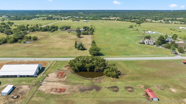 drone / aerial view featuring a water view and a rural view