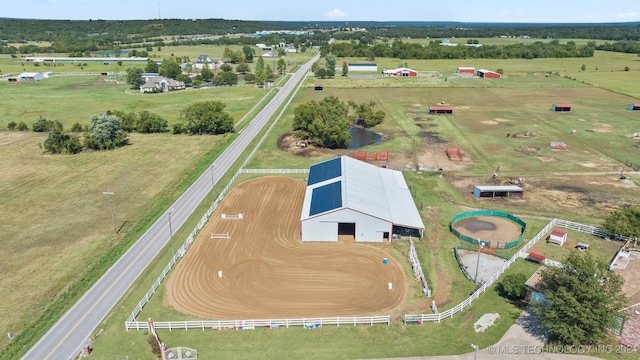 birds eye view of property with a rural view