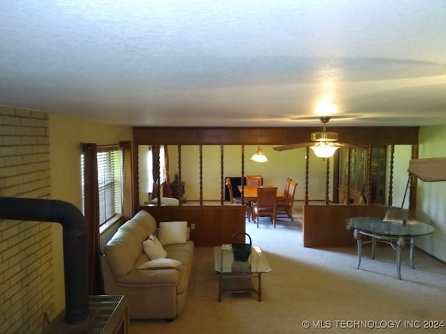 living room with light carpet and ceiling fan