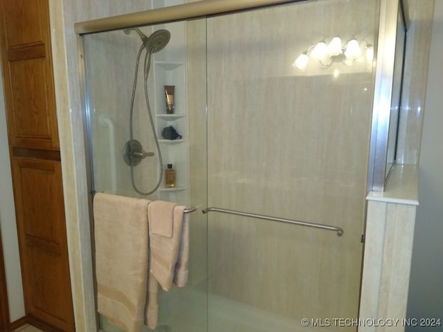 bathroom with an enclosed shower