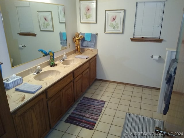 bathroom with tile patterned flooring and vanity