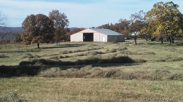 view of yard with a rural view