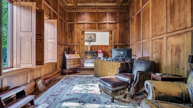 office space featuring wood-type flooring and wooden walls