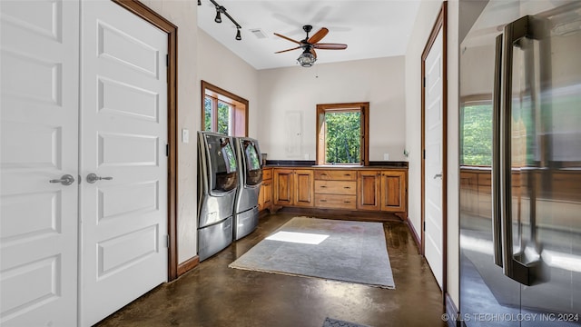 interior space featuring washer and clothes dryer, ceiling fan, and track lighting