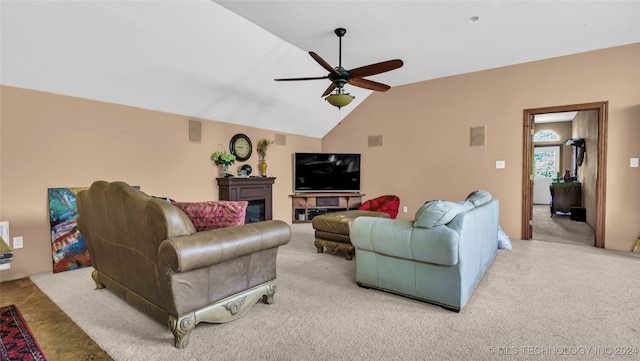 living room with vaulted ceiling, light carpet, and ceiling fan