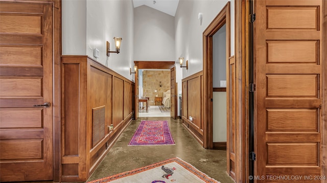 foyer entrance with high vaulted ceiling