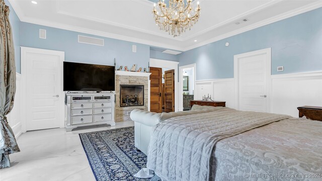 bedroom featuring a chandelier and crown molding