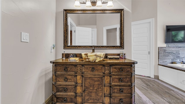 bathroom with vanity and hardwood / wood-style floors