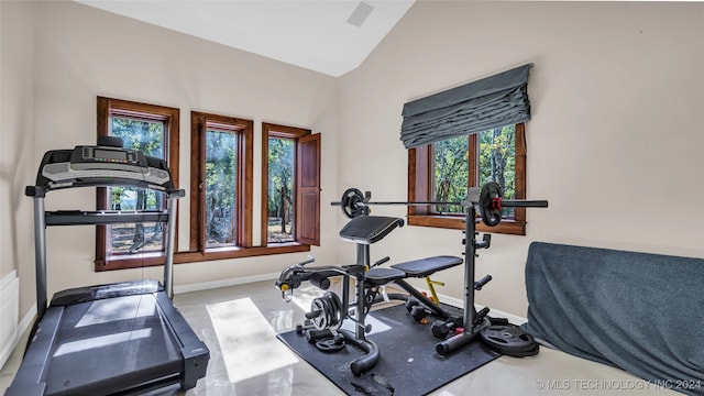 workout room featuring vaulted ceiling