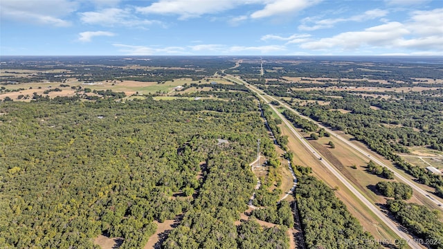 birds eye view of property with a rural view