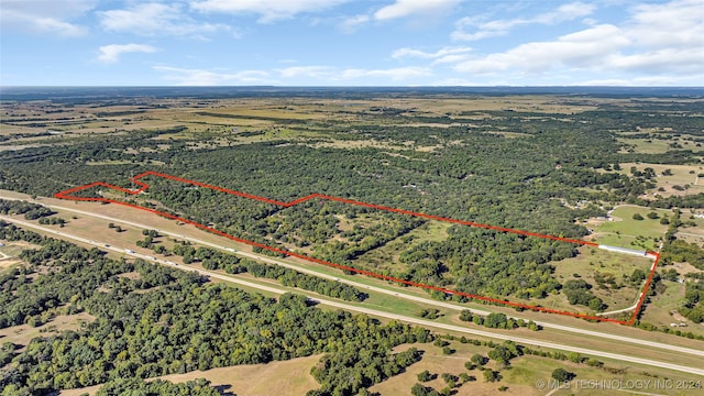 birds eye view of property with a rural view