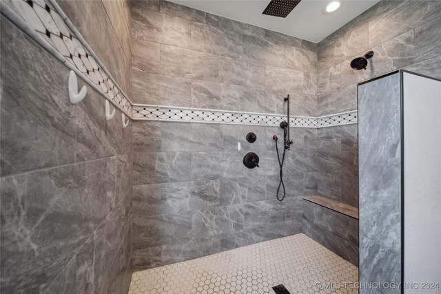 bathroom with a tile shower