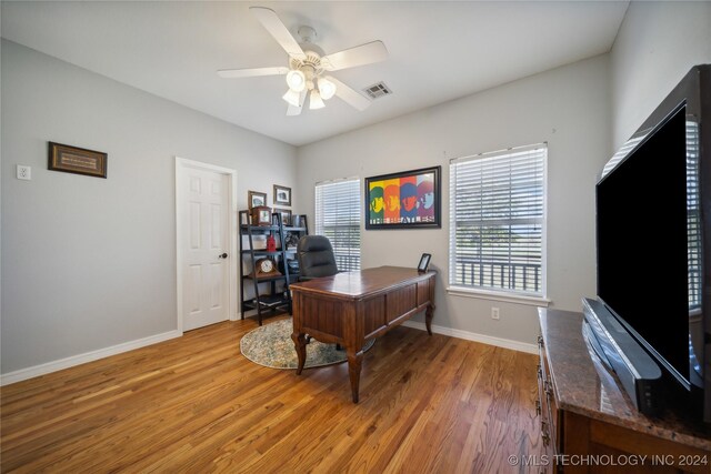 office area with ceiling fan and hardwood / wood-style flooring