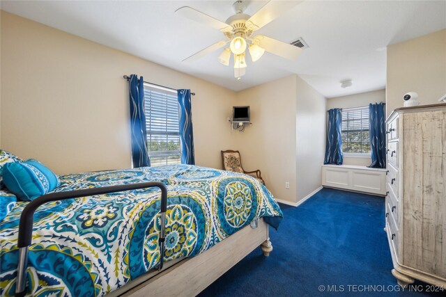 carpeted bedroom featuring ceiling fan