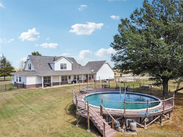 view of swimming pool featuring a yard