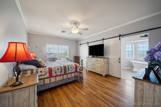 bedroom with light hardwood / wood-style flooring, ornamental molding, multiple windows, and ceiling fan