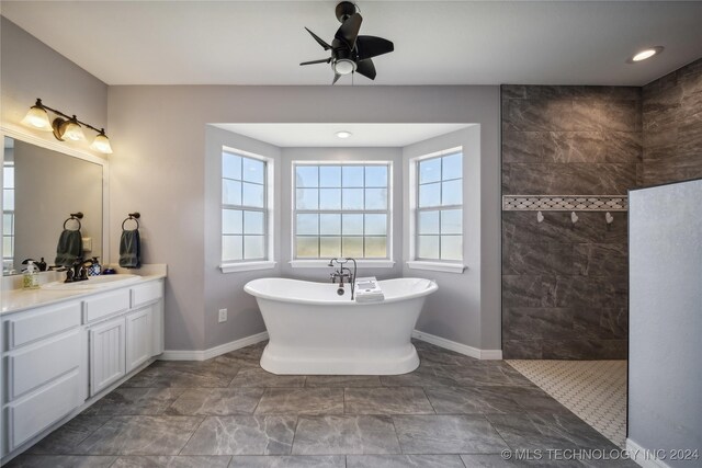 bathroom with shower with separate bathtub, vanity, and ceiling fan