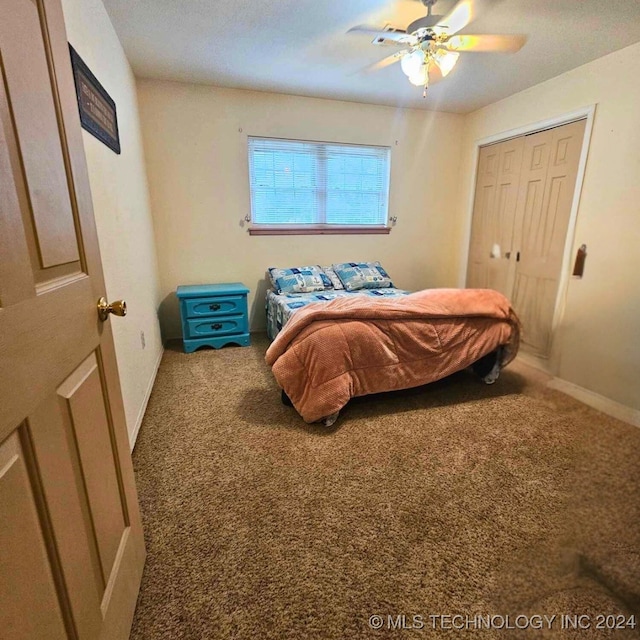 bedroom featuring carpet flooring, ceiling fan, and a closet